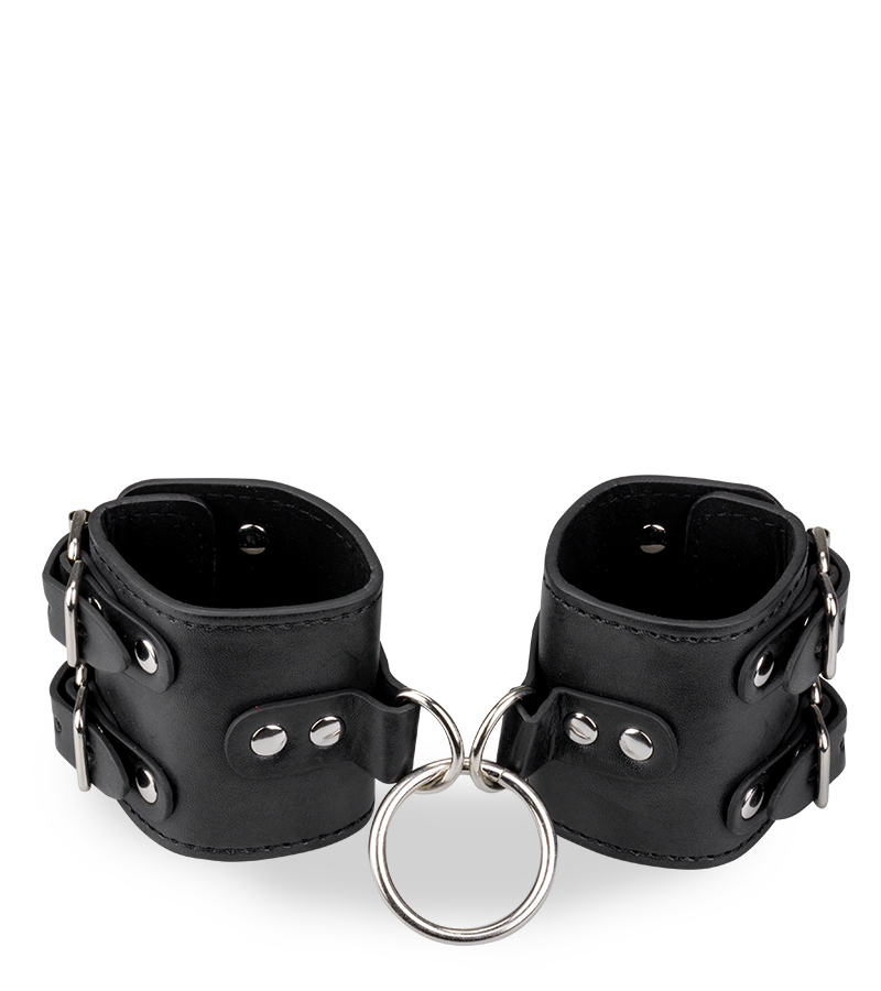 Black leather BDSM handcuffs with straps