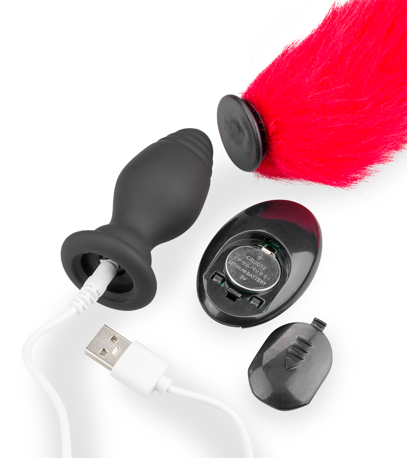 Red faux fur vibrating butt plug