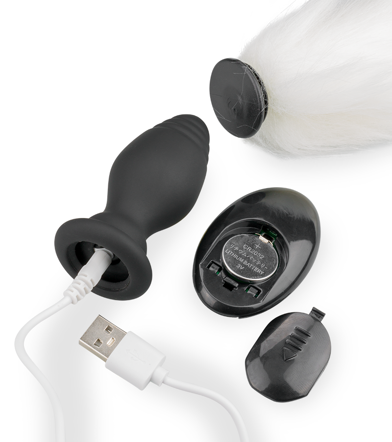 Vibrating butt plug with white synthetic fur tail